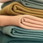 folded fabric samples showing different weights and textures